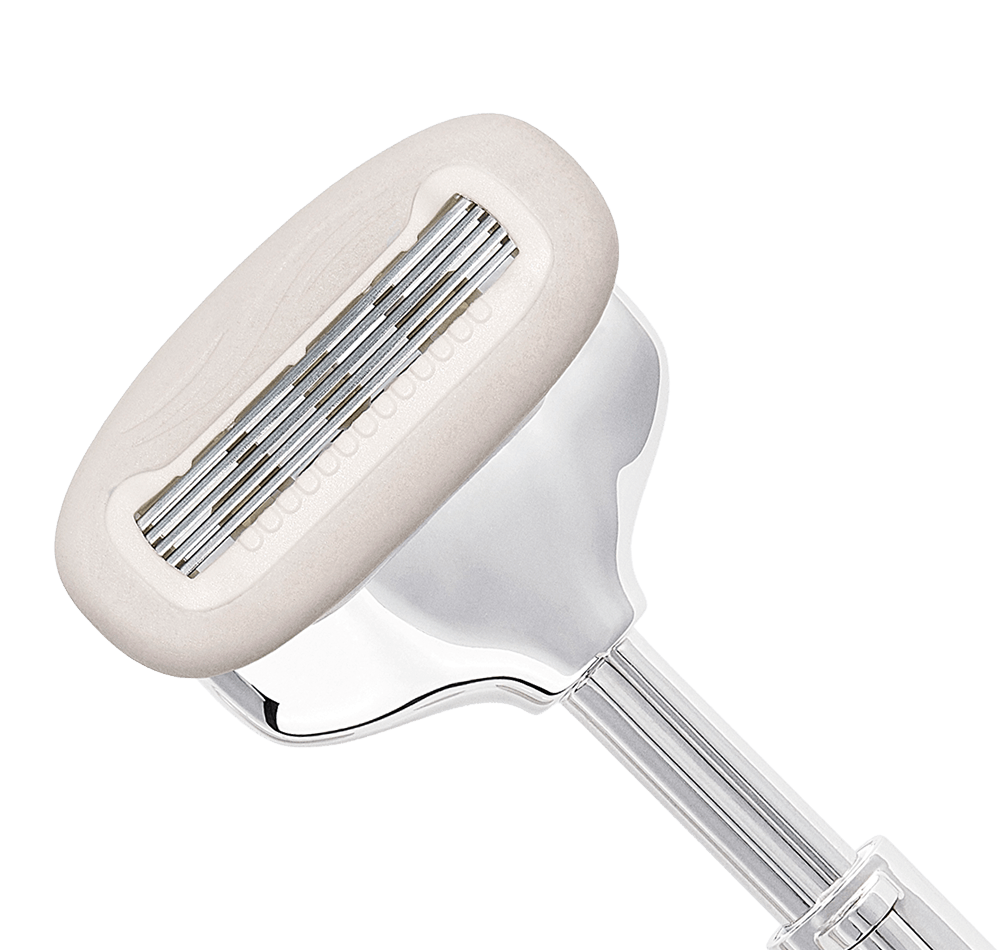 Close-up detail of SKAURA 5-blade razor head on a white background