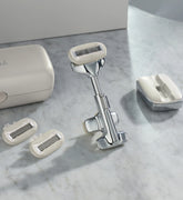 Shaving system with razor and replacement heads on a marble surface